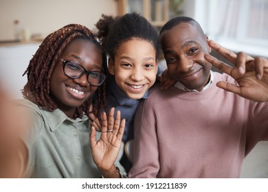 POV Shot Of Happy African-American Family Smiling At Camera While Taking Selfie-photo At Home Or Using Video Chat