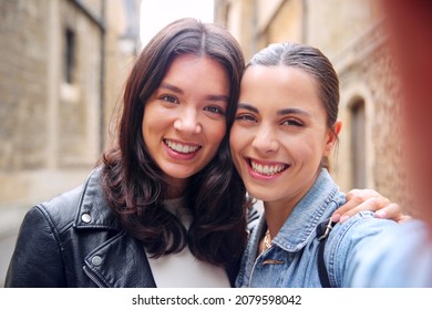 POV Shot Of Same Sex Female Couple Pose For Selfie As They Visit Oxford UK Together