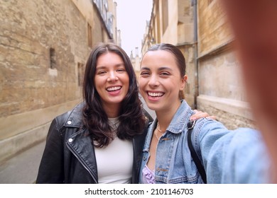 POV Shot Of Same Sex Female Couple Pose For Selfie As They Visit Oxford UK Together