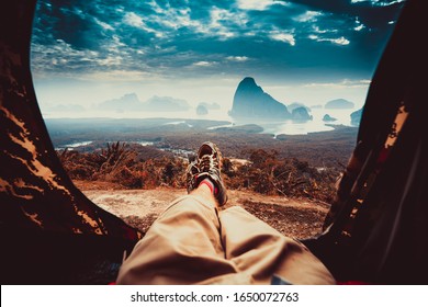 POV View Of Hipster Tourist Inside Tent On Front Of Mountains And Sea. Adventure Travel Lifestyle Wanderlust