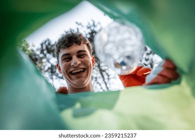 POV view from inside of the bag young volunteer teenagers collect plastic waste from nature eco awareness and recycle concept - Powered by Shutterstock