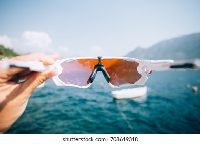 POV view on sailing boats parked in quiet bay on adriatic sea, shot through lenses of action sport glasses or googles, protection from UV rays
