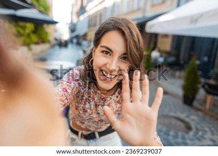 Similar – Image, Stock Photo Young woman vlogging outdoors with a mobile gimbal