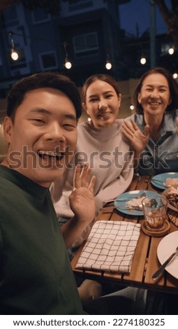 POV webcam screen group facetime videocall looking at camera greeting smile laugh fun joy talk online at dine table night party at home. Enjoy mobile phone selfie app with young senior middle aged mom