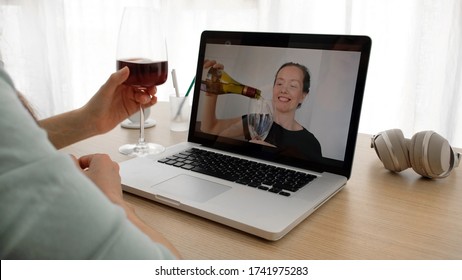 POV WEBCAM VIEW Happy Smiling Caucasian Females Talks By Web Camera With White Wine And Clinking Glasses While Having A Video Call