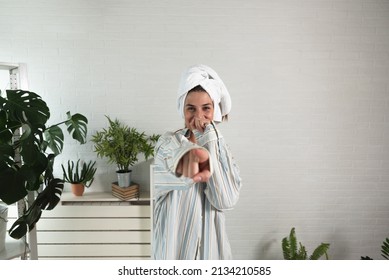 POV Of Young Happy Woman Or Girl Dancing In The New Apartment In Boyfriend Shirt And Towel On Her Head Happy That She And Her Boyfriend Have They Own Home. With Motion Blur Film Noise Real People.