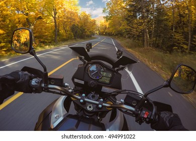 POV  Of Young Man Riding On A Motorcycle. Hands Of Motorcyclist On A Street Forest