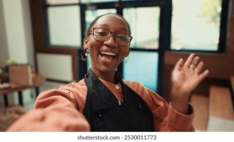 POV zero waste storekeeper creating marketing video for social media, presenting additives free homemade sauces and other organic pantry essentials. Merchant promoting her local ecological shop. - Powered by Shutterstock