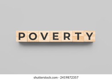 poverty wooden cubes on gray background