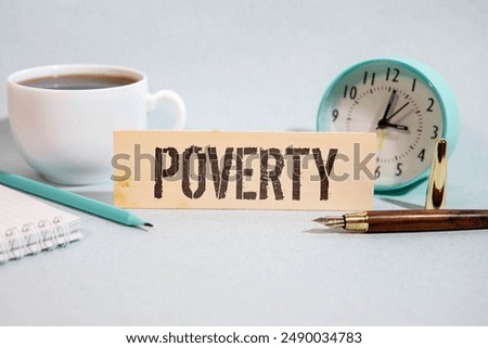 Poverty word written on wood block. Poverty text on cement table for your desing, concept.