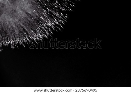 powder burst in black background