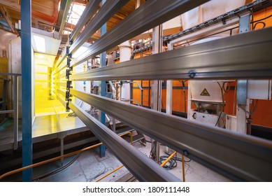 Powder Coating Line. Metal Detail In The Spray Booth.