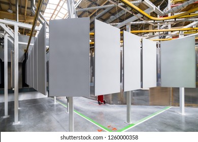 Powder Coating Line. Metal Panels Are Suspended On An Overhead Conveyor Line. Painting Products In An Electrostatic Field.