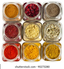 powder colorful spices in glass bottle close up , top view,  isolated on white background - Powered by Shutterstock