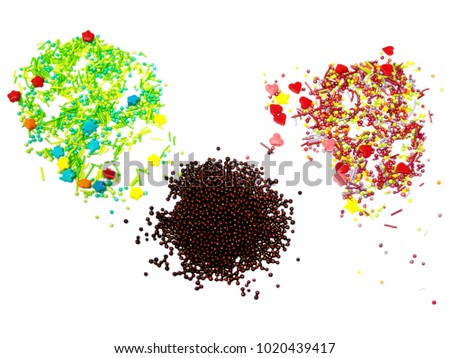 Powder for decorating festive Easter cakes. Multicolored stars, hearts, peas. Isolated on white background.