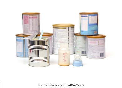 Powder Milk In A Can With Spoon With Different Brands Of Powder Milk Background