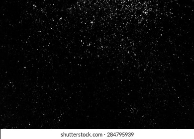 Powder Particles Or Snow Flying Over The Black Background