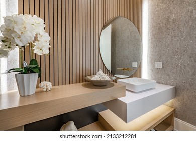 powder room with slatted wood walls orchid square sink and soft wood tones