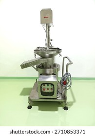 Powder sifting machine to remove impurities from powder in the powder puff industry.