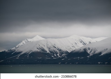 Powder snow covers peaks at Ny Alesund Svalbard in July