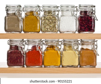 powder spices  in glass bottle isolated on white background