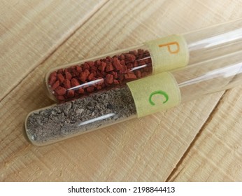 Powdered Gray Carbon And Red Crystalline Phosphorus In Test Tubes.