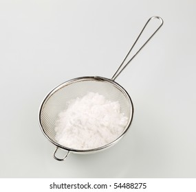 Powdered Sugar In A Metal Sieve