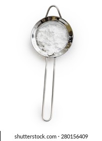 Powdered Sugar In A Metal Sieve With Slotted Spoon Isolated On White Background