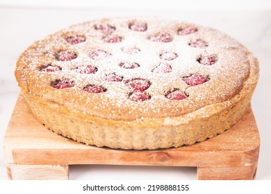 Powdered Sugar On Raspberry Frangipane Tart