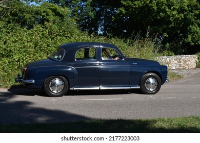 Powderham, Devon, UK. July 9th 2022. Rover P4 Vintage Car In Dark Blue. Pictured Driving Down A Country Road On A Hot Summers Day.Historic Vehicle Gathering Of Classic Cars. 