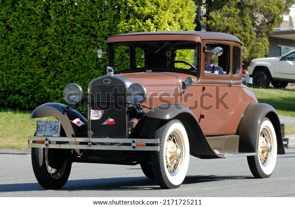 Powell River,\
British Columbia  CANADA - June 25, 2022: The Brooks Secondary\
School car parade proceeds north on Joyce Avenue, celebrating the\
graduating class of\
2022.