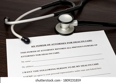 Power Of Attorney For Health Care, HCPA, With Stethoscope. Concept Of Planning For Death, Final Wishes, Terminal Illness, And Advance Directive During Covid-19 Coronavirus Pandemic