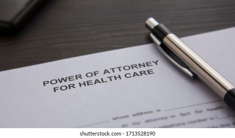 A Power Of Attorney On The Desk. Power Of Attorney For Health Care On The Table. 