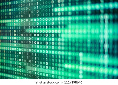 power of big data. binary code information bit on computer monitor screen display. green light text number one and zero. blur defocus blue bokeh light. technology graphic design background concepts