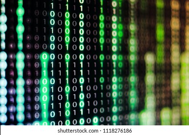 power of big data. binary code information bit on computer monitor screen display. green light text number one and zero. blur defocus blue bokeh light. technology graphic design background concepts
