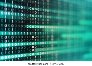 power of big data. binary code information bit on computer monitor screen display. green light text number one and zero. blur defocus blue bokeh light. technology graphic design background concepts