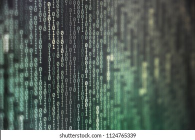 power of big data. binary code information bit on computer monitor screen display. green light text number one and zero. blur focused blue bokeh light. technology graphic design background concepts