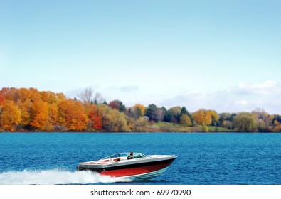 power boating on an autumn lake