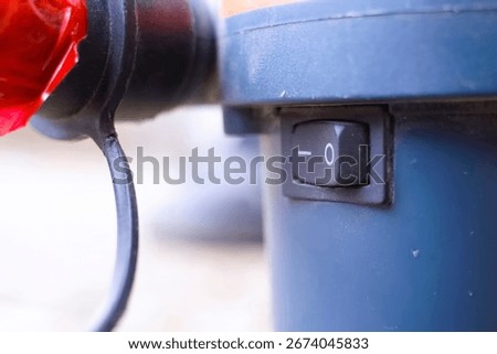 Power button of an angle grinder, electric supply of grinding tool