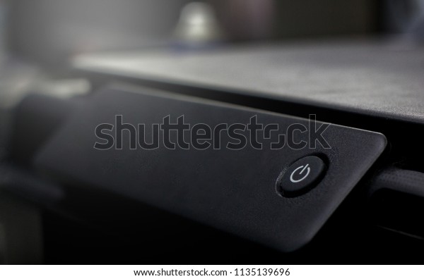 Power button Turn on and turn off the computer.Black\
and blur background \
