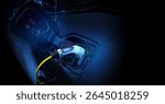 Power cable pump plug in charging power to electric vehicle EV car.