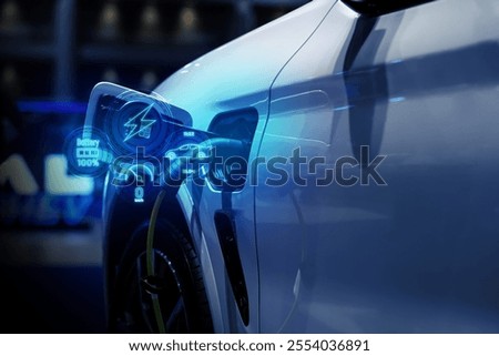 Power cable pump plug in charging power to electric vehicle EV car.