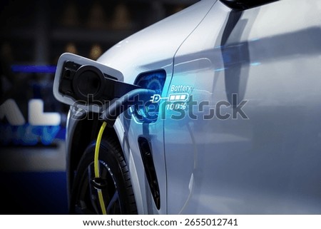Power cable pump plug in charging power to electric vehicle EV car.
