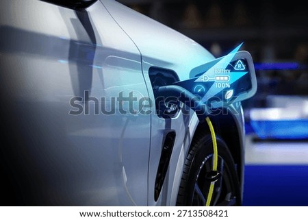 Power cable pump plug in charging power to electric vehicle EV car.