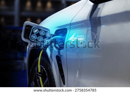 Power cable pump plug in charging power to electric vehicle EV car.