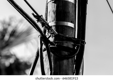 Power Cables on a wooden pole above a residential area.