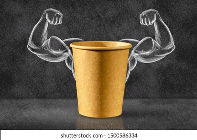 Power coffee. Cup of coffee on the background of depicted muscles on chalkboard. Strong power, muscle arms. Power concept. 