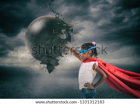 Power and determination of a super hero child against a wrecking ball