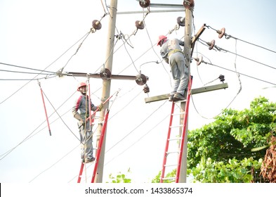 Power distributor engineers are working on the damaged pole in Lagos Nigeria, 23rd June 2019. Nigeria