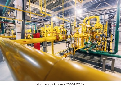 Power Electric Gas Factory Plant With Yellow Pipelines And Reed Valves.